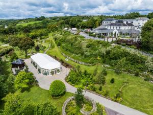 an aerial view of a garden with a white tent at Fernhill Hotel & Estate in Clonakilty