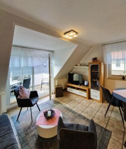 a living room with a couch and a table at _Neue Liebe_ Wohnung 3 in Groß Kirr