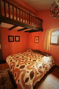 a bedroom with a large bed and a loft at Casa Tajinastes del Teide in Las Canadas del Teidn