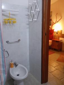 a bathroom with a toilet and a sink at In Sardegna da Anna Rita in Scano Montiferro