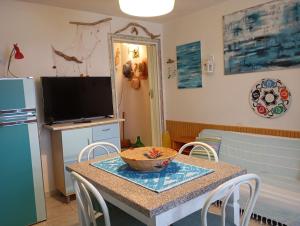 a dining room with a table with a bowl on it at In Sardegna da Anna Rita in Scano Montiferro