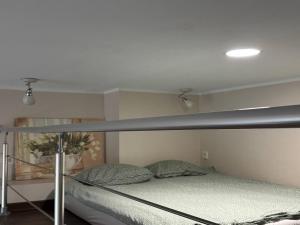 a bedroom with a bunk bed with a metal frame at Apartments near Noblessner in Tallinn
