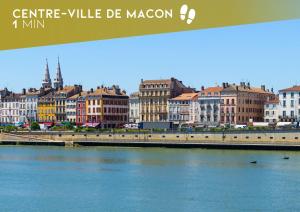 a view of a city with a river and buildings at Myappart71- Loft - centre ville in Mâcon