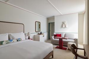 a hotel room with a bed and a couch at Miiro Spittelberg NEW OPENING in Vienna