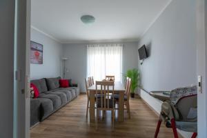 a living room with a couch and a table at Apartments Slavek in Jastrebarsko