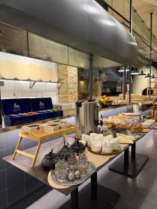 a kitchen with a table with food on it at KUMA Hotel Gyumri in Gyumri