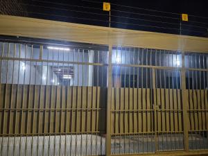 a large cage with windows in a building at Kitnet Vale do Amanhecer - Templo Mãe in Planaltina