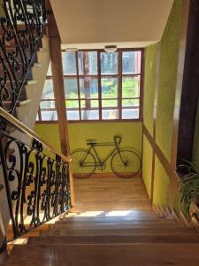 a bike parked in a room with green walls at Antiguas Eras La Alberca in La Alberca