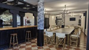 a large dining room with a table and chairs at Antiguas Eras La Alberca in La Alberca