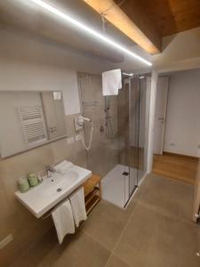 a bathroom with a sink and a shower at Residenza Della Samaritana in Verona +71 photos