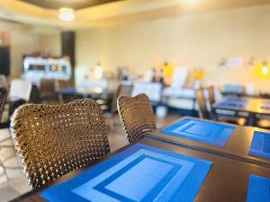 a table and chairs with a tablet on top of it at Hotel L'Oie des neiges in Lévis