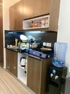 a kitchen with a counter with a stove at Brizelle studio in Ongata Rongai 