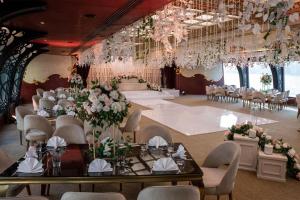 a banquet hall with tables and chairs and chandeliers at Hilton Cairo Grand Nile in Cairo +111 photos