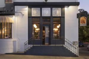 a building with a staircase in front of a door at Graduate by Hilton Berkeley in Berkeley