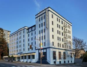 a white building on the corner of a street at Graduate by Hilton Berkeley in Berkeley