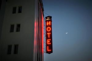 a neon sign on the side of a building at Graduate by Hilton Berkeley in Berkeley +110 photos