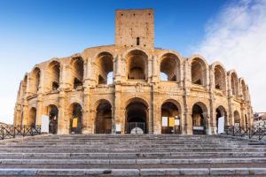 a large building with stairs in front of it at Arles Getaway - Le Flamant Vert in Arles