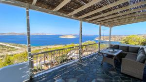 a view of the ocean from the balcony of a house at Gaia in Agios Georgios