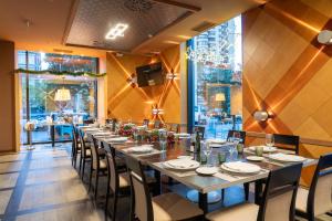 a long dining room with a long table and chairs at Abba Madrid in Madrid