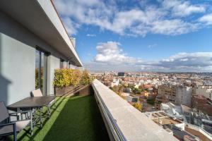 a balcony with a view of a city at Abba Madrid in Madrid