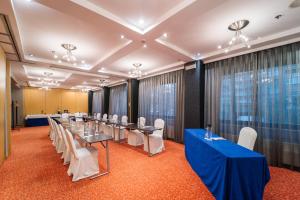 a conference room with a long table and chairs at Abba Madrid in Madrid
