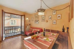 a living room with a table with a bowl of fruit on it at Rochebrune Apartments in Ski Resort in Claviere