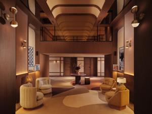 a lobby with chairs and a table in a building at Villa Sahrai, a Member of Design Hotels in Casablanca
