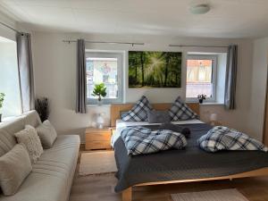 a living room with a couch and a couch and a living room at Ferienhaus Gertrud in Nesselwängle