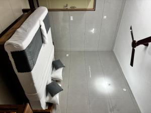 a room with a bed with pillows at Nest Inn in Suntikoppa +14 photos