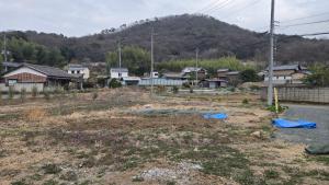 a small town with houses and a mountain at The Kominka-house Olive in Sano