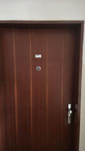 a wooden door with a sign on it at Apartmán Mírová 472 B in Milovice +2 photos