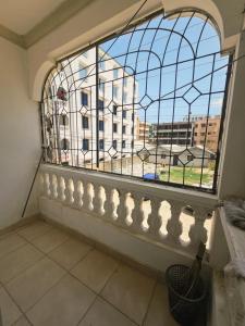 a window with a view of a building at Mokaya Investments in Mombasa