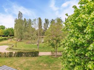 a view of a park with trees and a path at Willow Loft - Uk49479 in Bulmer
