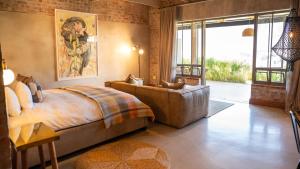 a bedroom with a large bed and a large window at De Zeven Guest Lodge in Stellenbosch +75 photos
