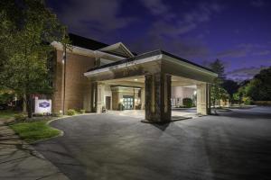 a building with a parking lot in front of it at Hampton Inn East Aurora, NY in East Aurora