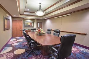 a conference room with a wooden table and chairs at Hampton Inn Siloam Springs in Siloam Springs +33 photos