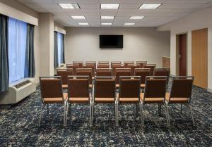 a conference room with chairs and a flat screen tv at Hampton Inn & Suites Greenfield in Greenfield +56 photos