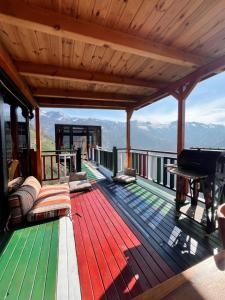 a deck on a house with a grand piano at Northland Bungalows in Çayırdüzü +216 photos