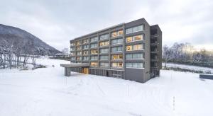 a rendering of a building in the snow at Hinode Hills Niseko Village in Niseko