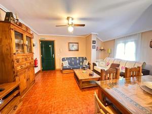 a living room with a couch and a table at Apartamento El Rey in Colombres +13 photos