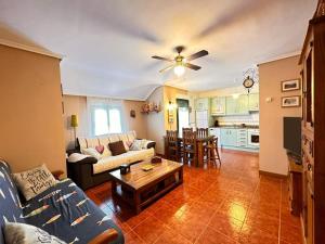 a living room with a couch and a table at Apartamento El Rey in Colombres