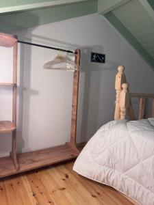 a bedroom with a bed and a glass wall at La Maisonette de Symi in Symi