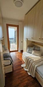 a bedroom with a bed and a view of the ocean at Appartamenti Vista Lago - Costermano sul Garda - Be Happy! in Costermano sul garda