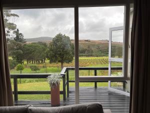 a room with a large window looking out at a field at The Suite in Stanford