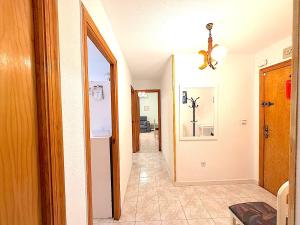 a hallway with a hallway leading to a room at Santa Pola port in Santa Pola +21 photos
