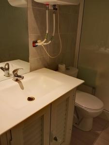 a bathroom with a sink and a toilet at Charmant studio à Sfax in Sfax