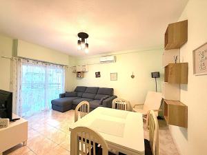 a living room with a couch and a table at Santa Pola port in Santa Pola