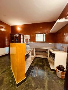 a large kitchen with a sink and a counter at Gravity Groups Blue Lagoon Villa in Kuilapayam