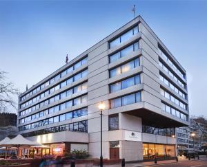 a large white building with a lot of windows at DoubleTree by Hilton London - Hyde Park in London