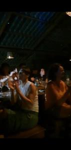 a group of people sitting at a table at Curly Hostel Negombo in Negombo +102 photos